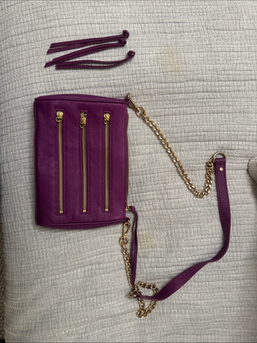 Purple Leather Crossbody Bag with Gold Chain and Zipper Accents